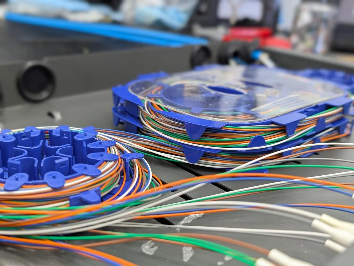 Stacked splice cassettes, fibres colour ordered before closing.