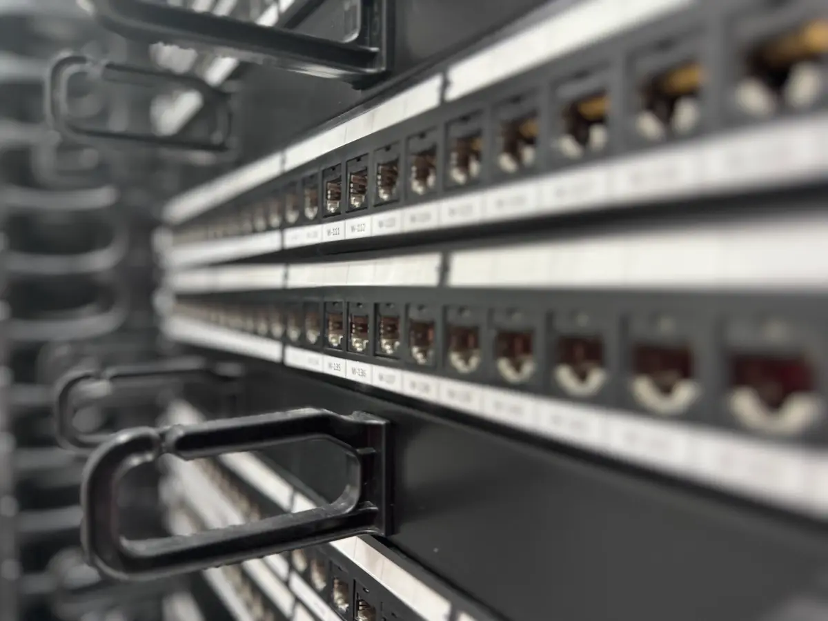Terminated patch panel, every port labelled.